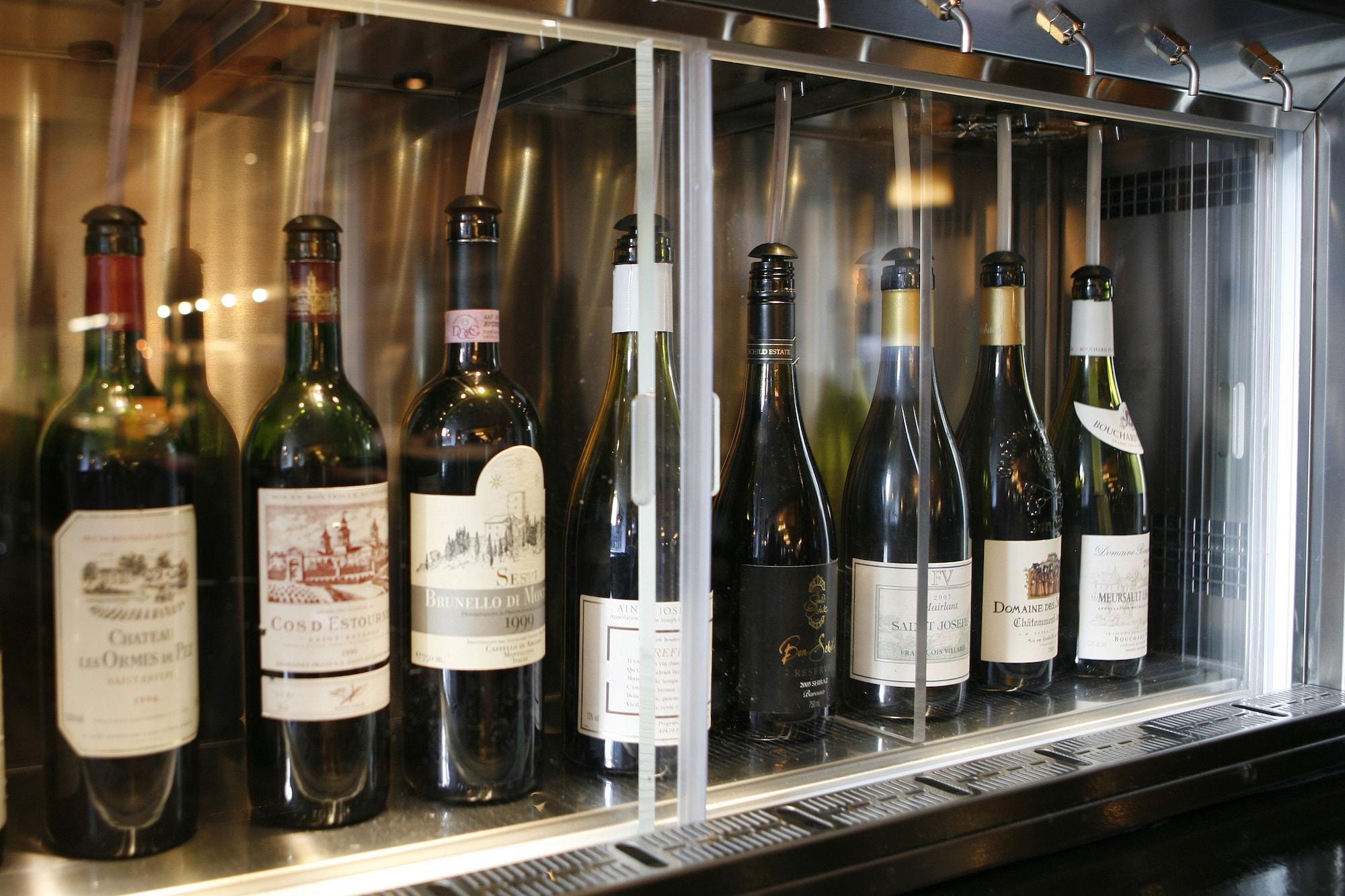 Montcalm Brewery, London City Екстер'єр фото Wine bottles in a wine dispenser